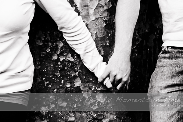 Black and White image of couple holding hands